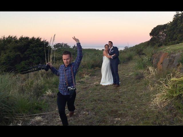 Hilarious wedding photographer making couple laugh