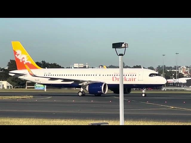 Drukair A320neo & Korean B777-300 arrives in Sydney on 34L. Qantas Link B717-200 taxis