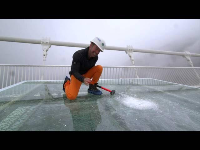 China's giant glass bridge hit with sledgehammer - BBC Click