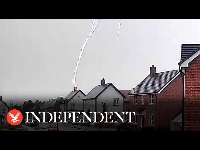 Moment lightning bolt strikes couple's home in Oxfordshire and destroys roof