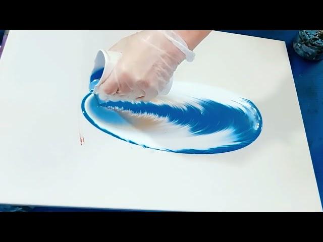 Acrylic filling of an interior painting with liquid acrylic.Fluid art.