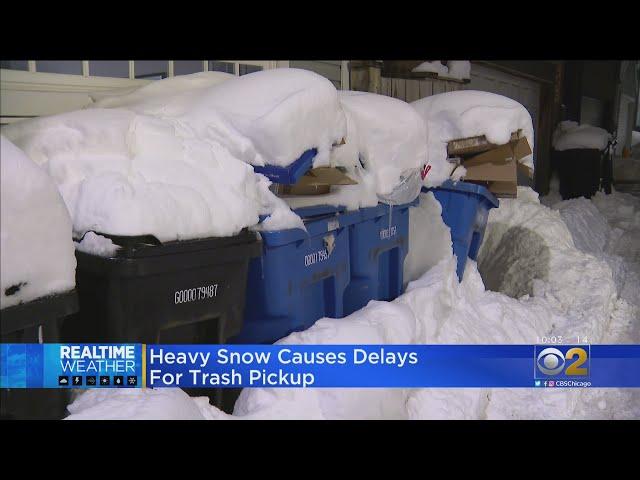 Heavy Snow Causes Delays For Trash Pickup