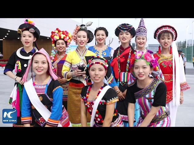 Girls of different ethnic groups show off traditional dances