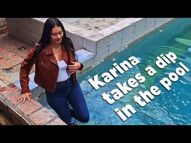 Karina takes a fully clothed dip in the pool (Wetlook)