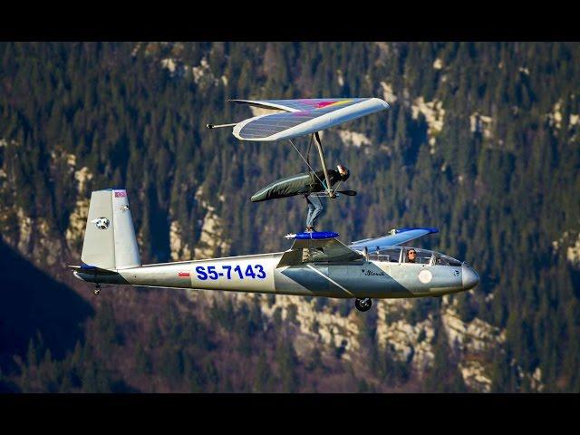 Hang Glider Touches Down on Sail Plane