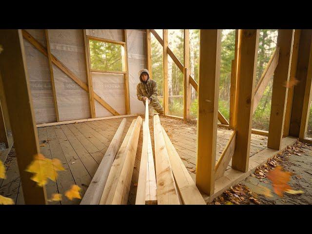 I finished sheathing the house with boards. Building a house in the woods.