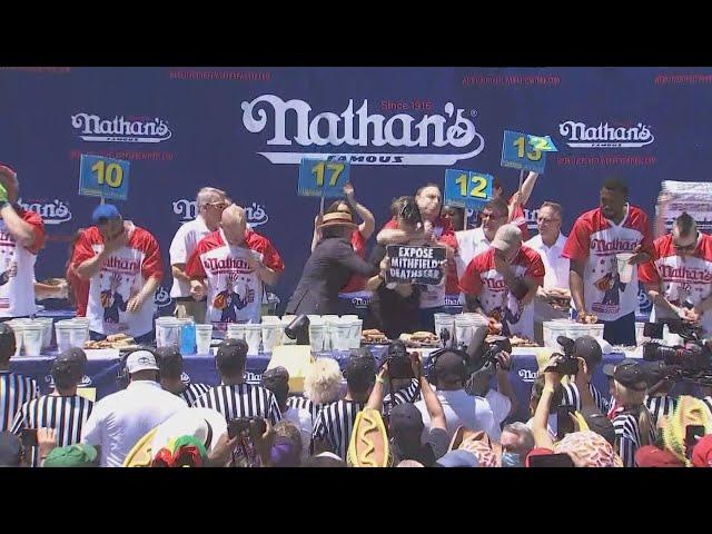 Joey Chestnut chokes protestor during Nathan's Hot Dog Eating Contest 2022