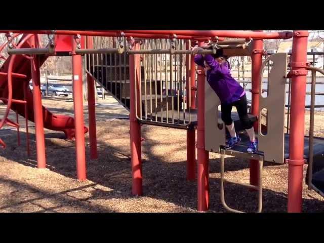 Emily on the monkey bars