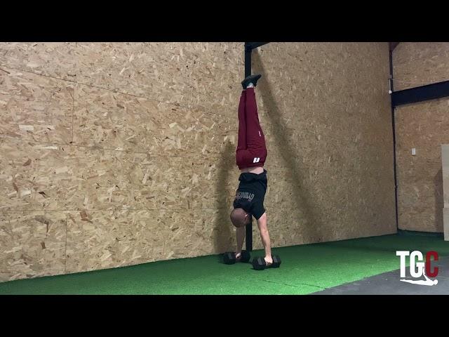 DB lateral handstand hold: Gymnastics Programming