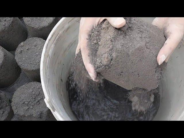 extremely dusty soft creamy charcoal wholecrush in water bucket 