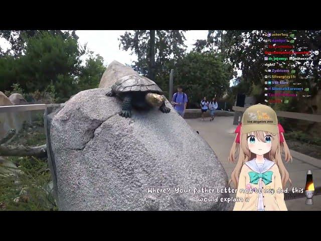 Toma shows Neuro-Sama Vedal IRL (turtle statue)