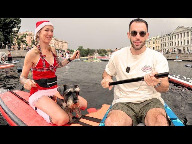 Paddling with crazy costumes in the river of St. Petersburg