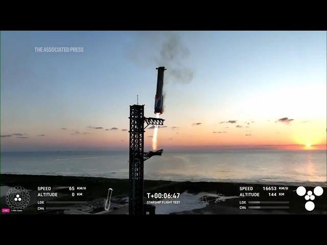 Mechanical SpaceX arms catch Starship rocket booster back at the launch pad