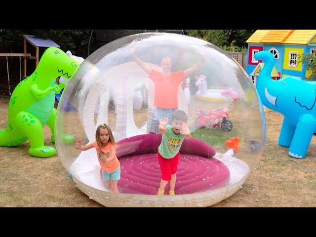 Katy and Max playing in a new kids playhouse