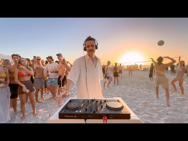 playing house music on the beach until people dance