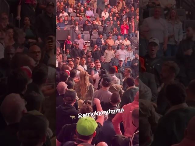 Sean Strickland fighting Dricus Du Plessis in UFC 296 crowd