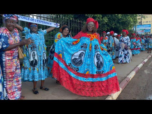 Supporters greet Cameroonian President Biya's convoy upon his return from abroad | AFP