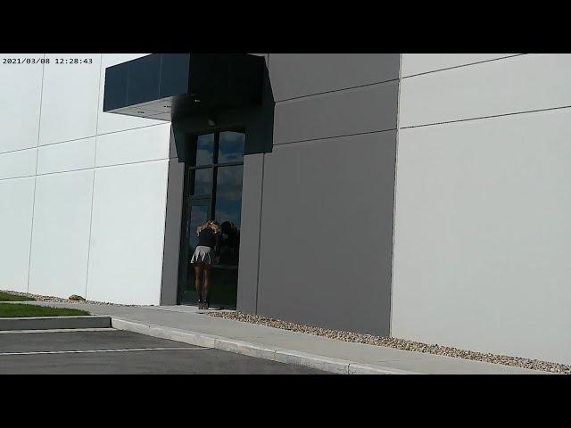 Blonde mini skirt blowing in the wind with nylons and high heels / stilettos office