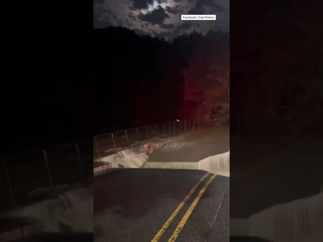 Intense Flooding Triggers Road Collapse In Stony Brook, New York