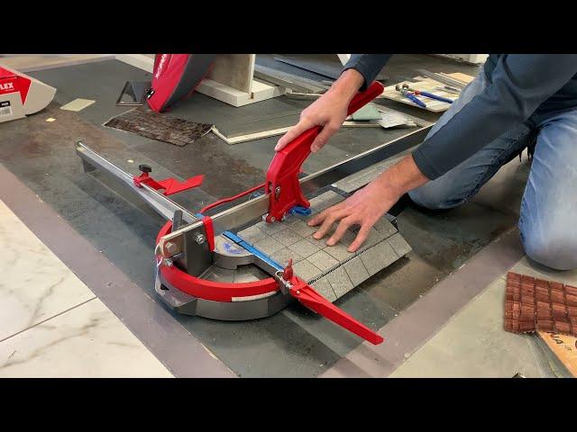 Cutting 1 cm thick porcelain mosaic with a manual tile cutter