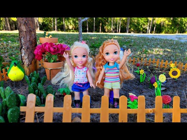 Gardening ! Elsa & Anna toddlers plant flowers outdoors