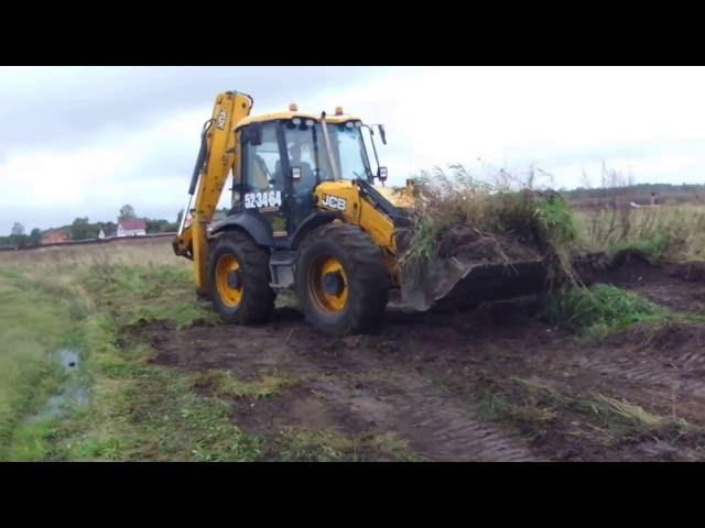 Планировка участка трактором  JCB - срезка бугров 