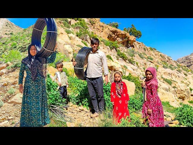 Water piping in the mountains by a nomadic family