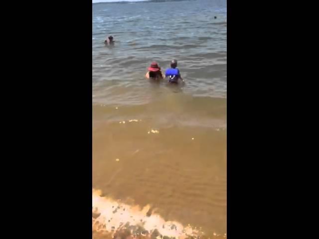 Javie Lents jr walking into the water at Kentucky lake