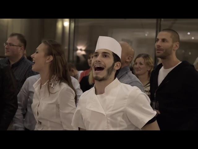 Flash Mob - Singing "We Will Rock You" in a hotel 