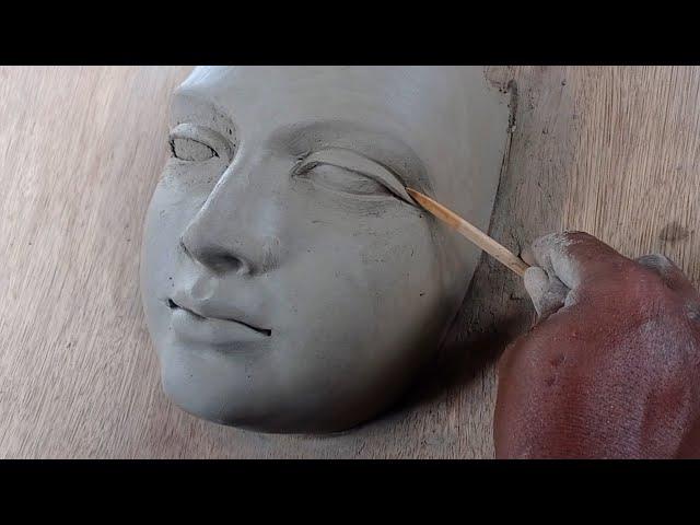 making a female face with water based clay//how to make a face with clay... sculpting face in clay