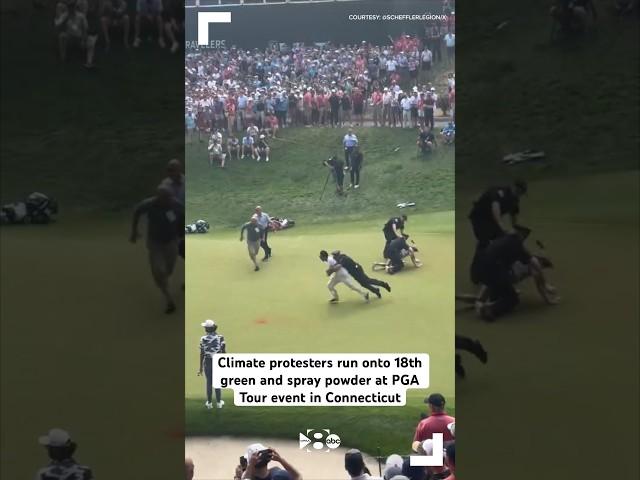 Climate protesters run onto 18th green and spray powder at PGA Tour event in Connecticut