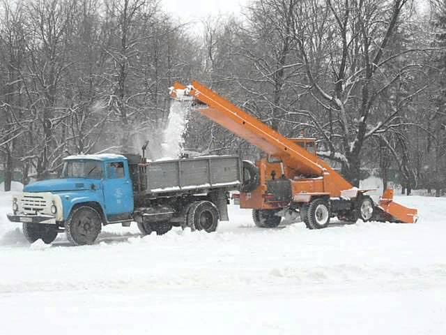 Russian snowloader KO-206AN loadin"ZIL-MMZ dump truck