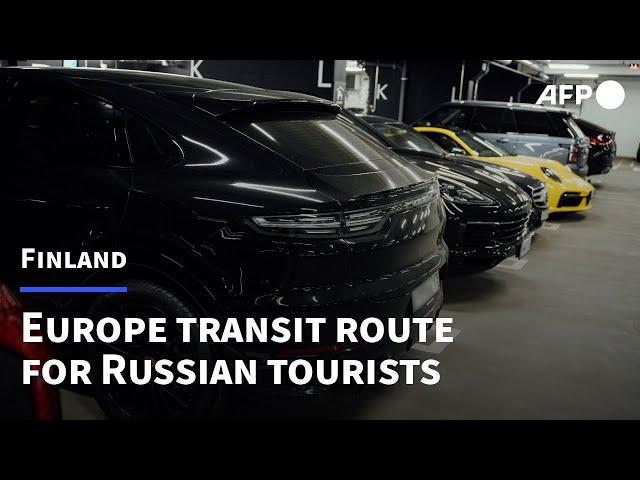 Russian tourists' luxury cars fill up Helsinki airport | AFP