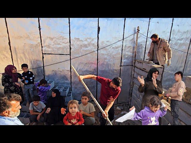 Rural life in Iran . Pern family is building a new barn next to the stable