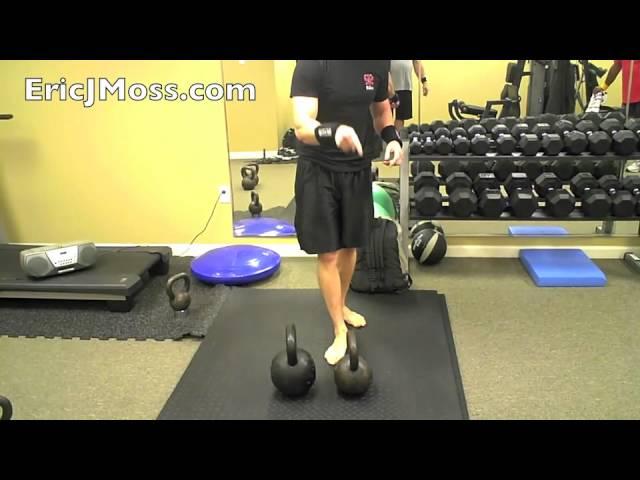 Eric Moss does a 114lbs. Stacked Kettlebell Bent Press