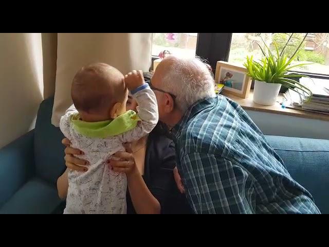 baby doesn't let grandpa kiss his mom