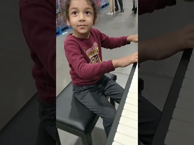 Trying Piano at Costco