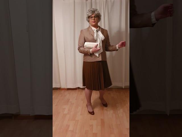 elegant crossdresser - mature lady in pleated leather skirt and silk bow blouse