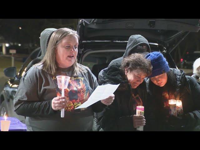 Vigil held at car wash for first victim in crime spree