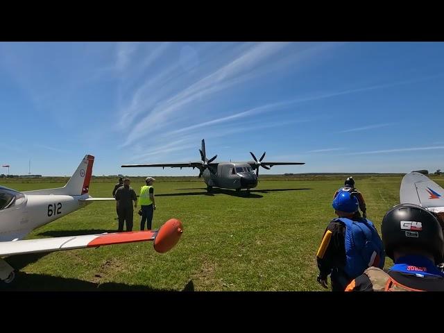 Twin Turboprop airplane trying to reverse thrust out of the soft grass