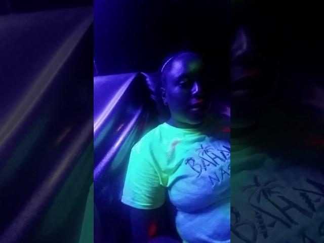 Waiting in the neon room to play lazer tag with the family.