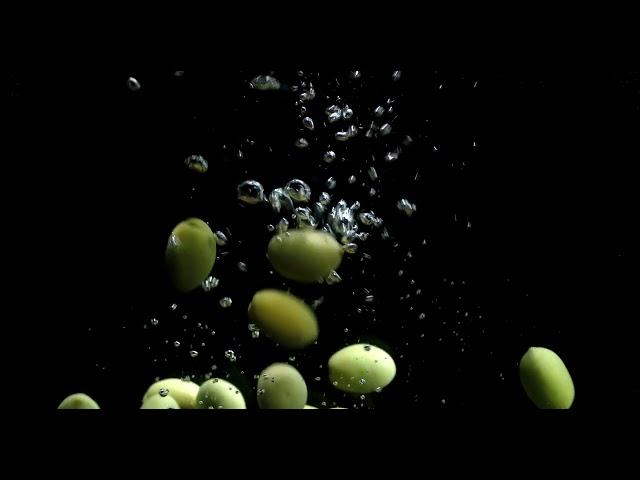 Free Footage: Olives fall into the water with air bubbles