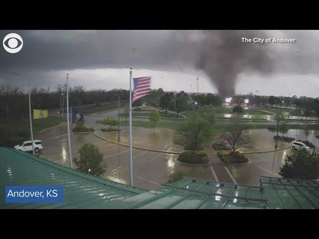 Tornado uproots trees as it rips through city in Kansas