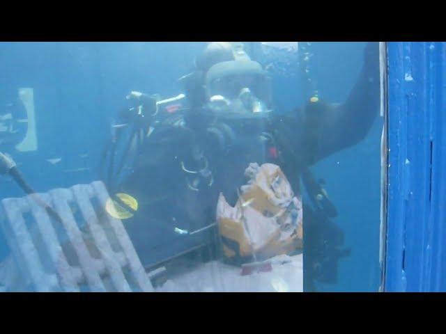 Female Commercial Diver is Diving with Viking Rubber Drysuit and Interspiro Full Face Mask in Pool