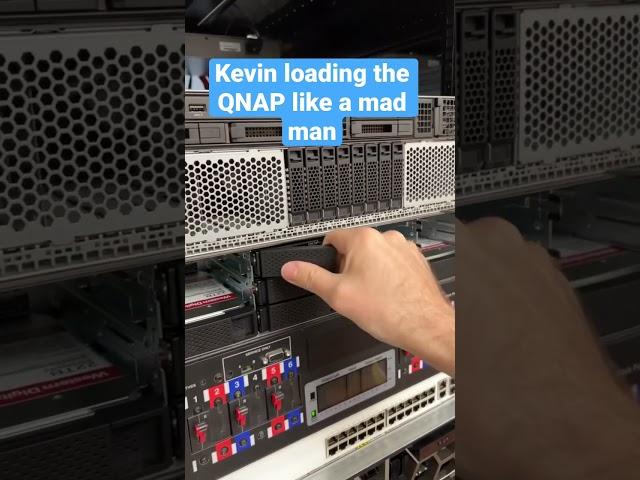 Kevin loading the WD 22TB Red Pro HDDs into the QNAP NAS like a crazy person. Review in process.