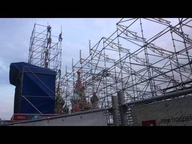Workers construct a construction at the Red Square