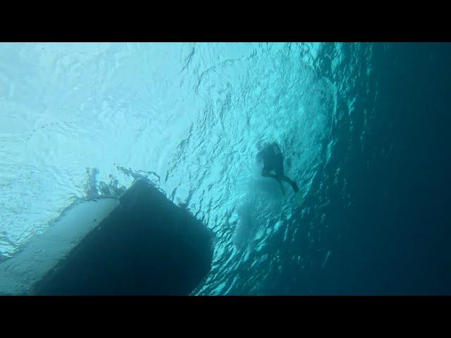 A Giant Stride Entry with a Half Twist, Cayman Brac