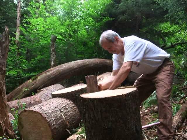 Luthier John Arnold splitting red spruce