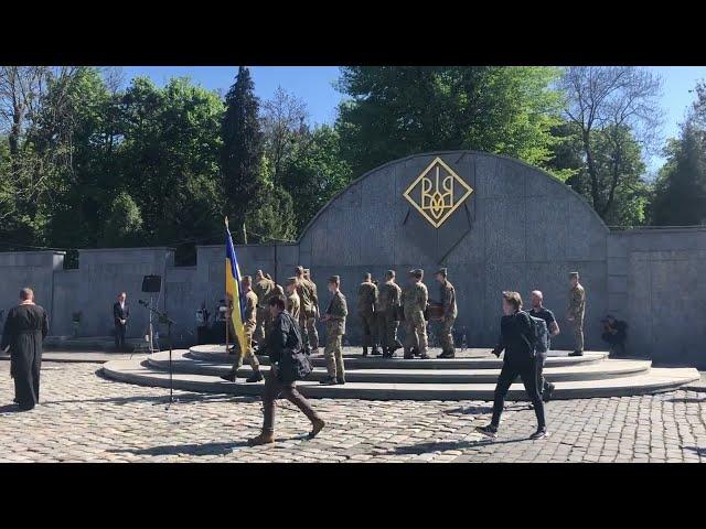 Ceremony of giving Ukrainian flag to wifes of Ukrainian soldiers during funeral at the Lviv Lychakiv