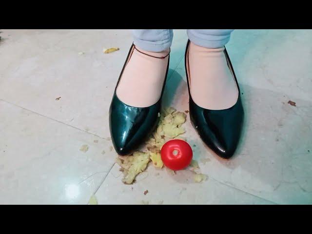 Potato Apple and Tomato crushing with black high heels